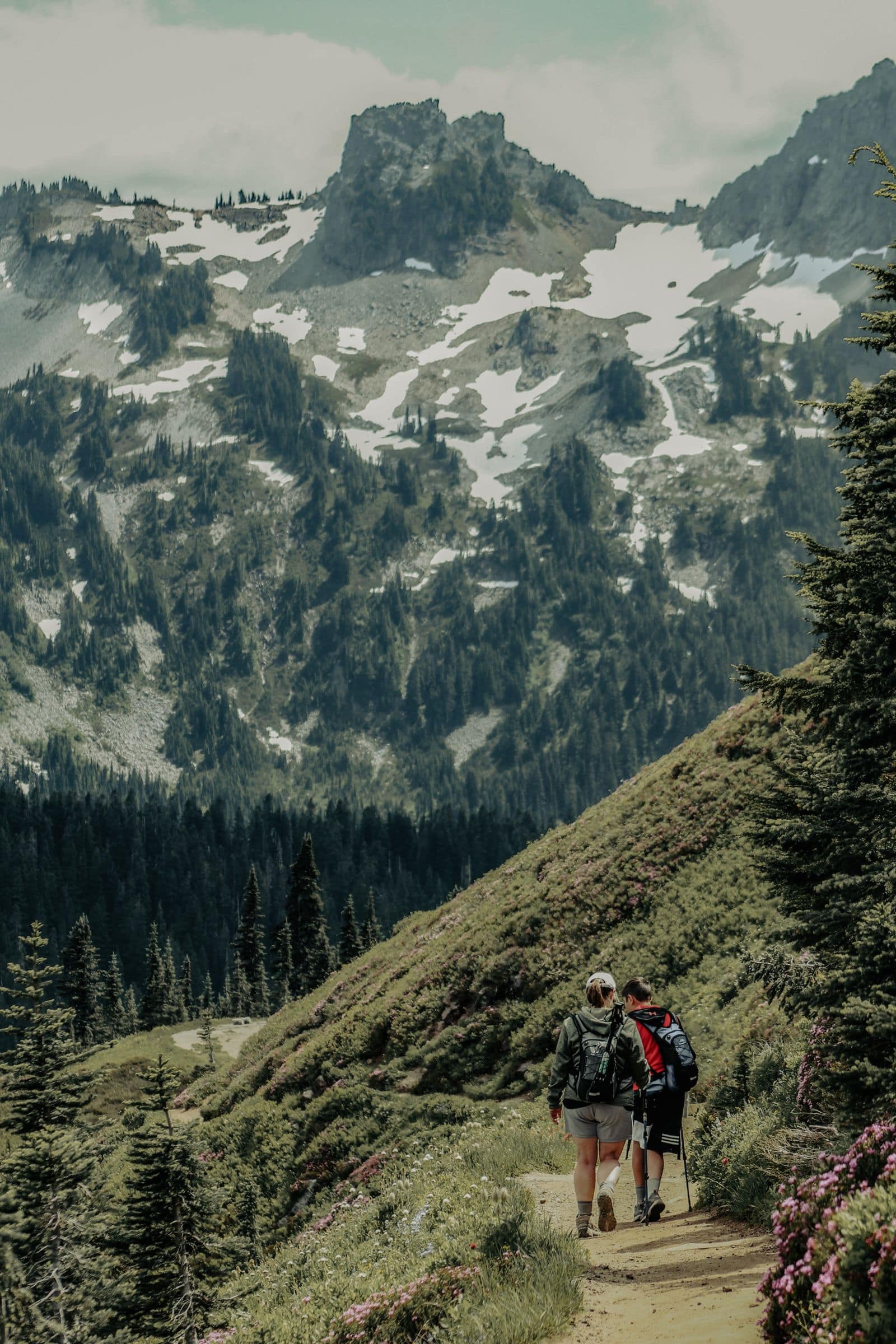 Two hikers on a mountain trail. Photo by Taylen Lundequam via Pexels.